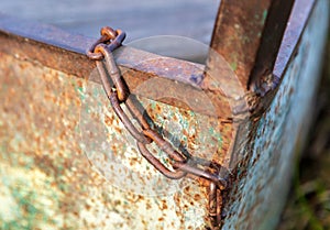 Old rusty metal chain on a boat