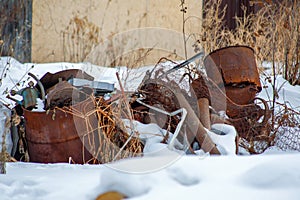 Old rusty metal dump in the snow