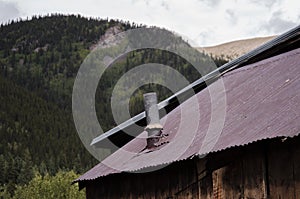 Old rusty metal roof with Chimney Vent