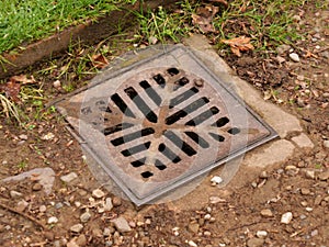 Old rusty metal sewer grate