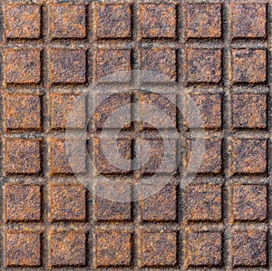 Old rusty metal street sewer drain cover top hatch texture.