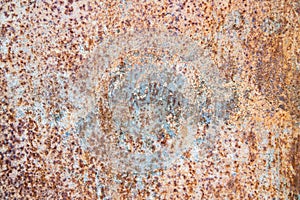 Old rusty metal texture on the surface of an iron sheet with pitting