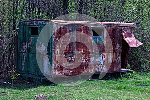 Old rusty metal trailer home