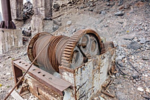 Old rusty metal Winch with coiled rope