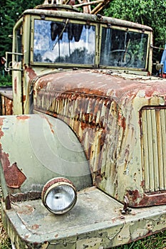 Old rusty military car in the garden