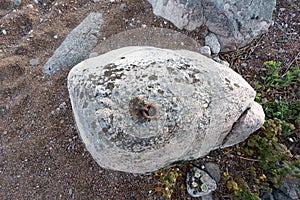 Old and rusty mooring ring for ships fixing.