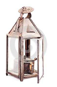 Old rusty oil lamp isolated