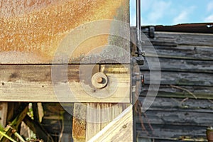 Old rusty oil tank seen on an old dairy farm in winter.