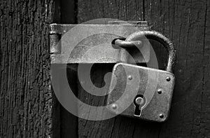 Old rusty padlock in black and white