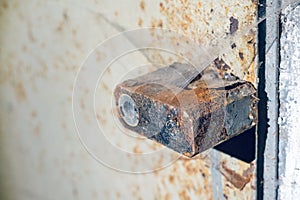 Old rusty padlock on metal doors close-up