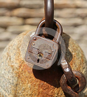 old rusty padlock to lock a chain