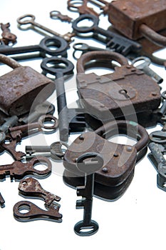 Old rusty padlocks and keys on white background. Mirror