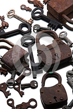 Old rusty padlocks and keys on white background. Mirror