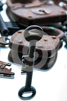 Old rusty padlocks and keys on white background. Mirror