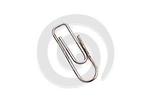 Old rusty paper clip, isolate on white background photo
