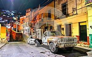 Old rusty pickup truck on a street of Guanajuato in Mexico