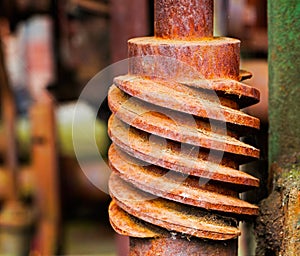 Old and rusty pinion gear of machine in factory