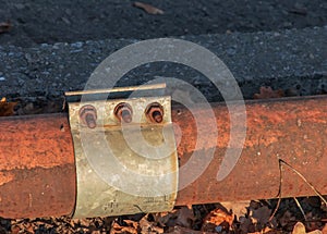 Old rusty pipe for hot water supply. Clamp for removing water leaks