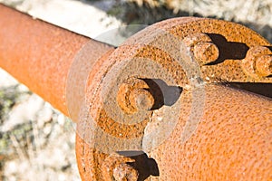 Old rusty pipeline with flange and bolts