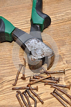 Old rusty pliers and nails