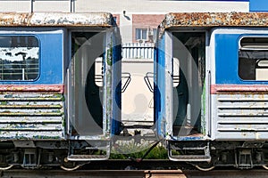 Old rusty railway wagon with an open door.