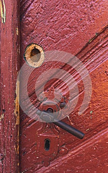 Old, rusty ,red door close-up