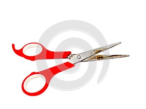 Old rusty red scissors isolated on white background