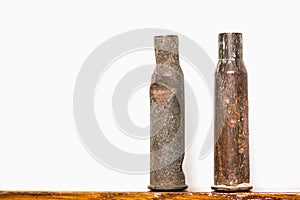 Old rusty rifle cartridges from the second world war on a white background