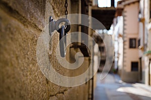 Old rusty ring fixed in stone brick wall