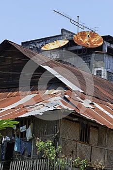 Old rusty satellite on country house