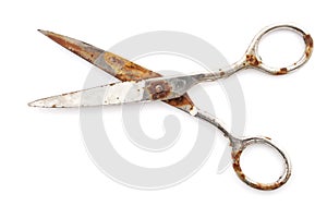 Old rusty scissors isolated on white