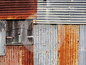 Old and rusty sheet metal facade background in the French West Indies. Sheet metal wall construction. Architecture concept