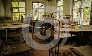 Old rusty soviet beds in kindergarten at Chernobyl ghost town, U