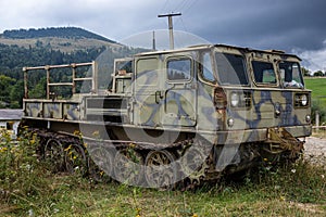 old rusty Soviet military tracked all-terrain vehicle