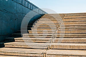 Old rusty staircase leading up to the blue sky