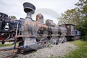 Old and rusty steam locomotive abandoned on an lost place train station