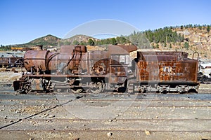 Old and rusty steam mining train used for transportation of the copper of