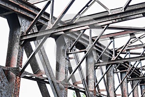 Old rusty steel bridge construction - rusted steel beams