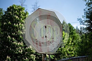 Old rusty stop roadsign