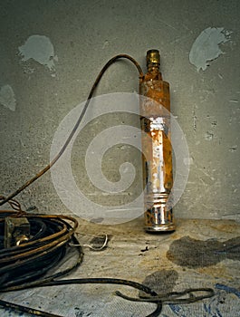 Old rusty submersible pump for drinking water