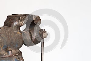Old rusty table vise isolated on white background