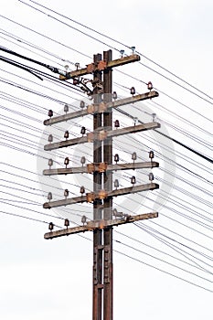 Old and rusty telegram tower and cable