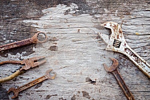 Old rusty tools on old wood background. wrench on wooden. rustic styles.