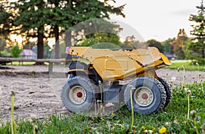 Old toy truck abandoned in the park playground