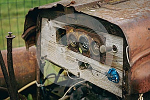 Old rusty tractor or car with handmade cheap instrument cluster