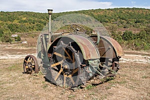 Old rusty tractor in a field