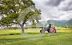 Old rusty tractor with storm weather!