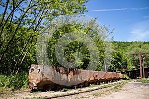 Old rusty train wagon forever parked at an abandoned railway station