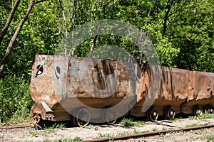 Old rusty train wagon forever parked at an abandoned railway station