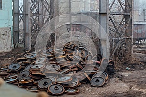 Old rusty train wheels in abandoned factory